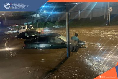 Rescuers pulled the stuck vehicles out of rainwater